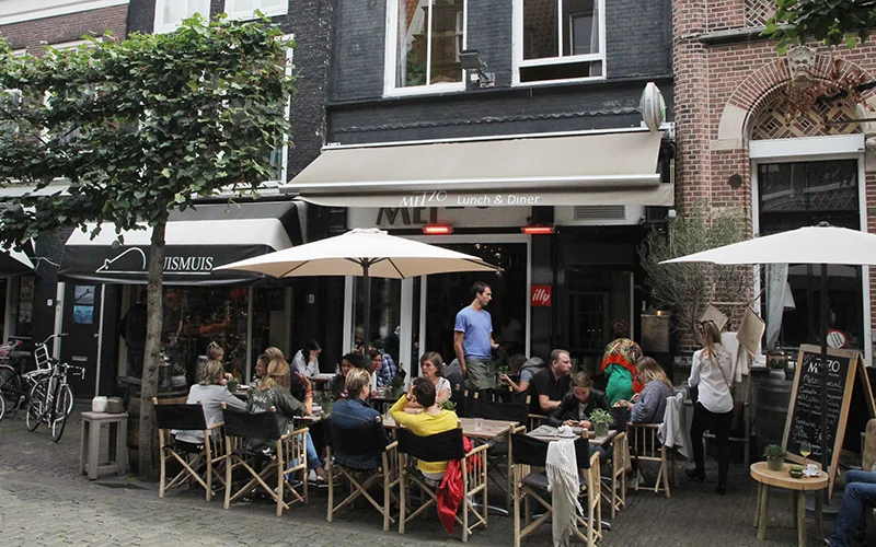Outdoor cafe with people sitting in Haarlem
