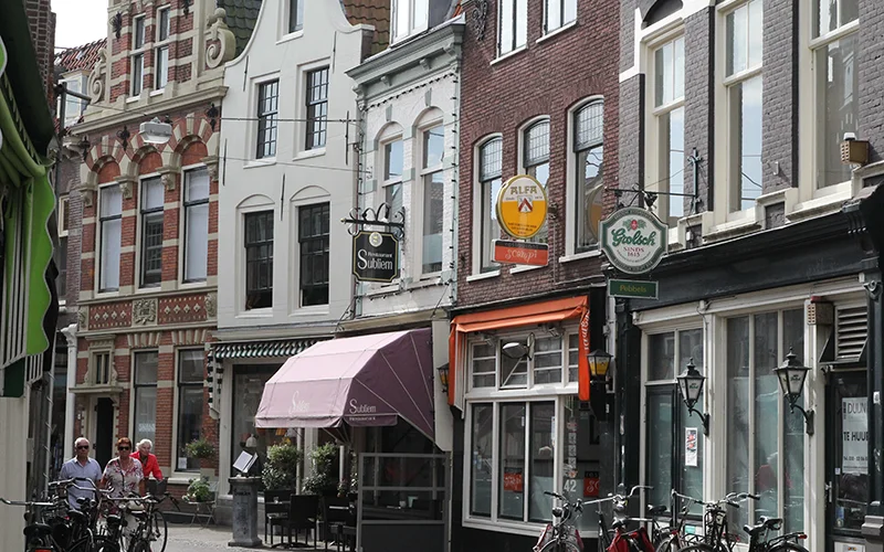 Street of old brick houses and shops in Haarlem