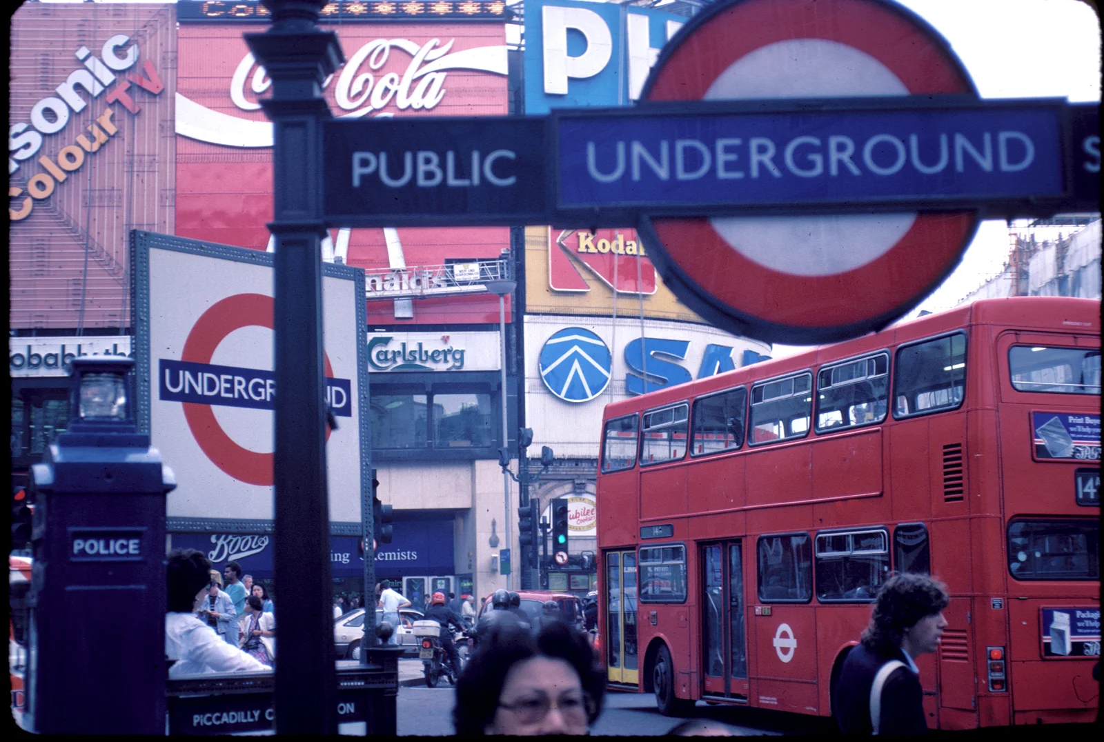 Piccadilly Circus in London with a red double-decker bus