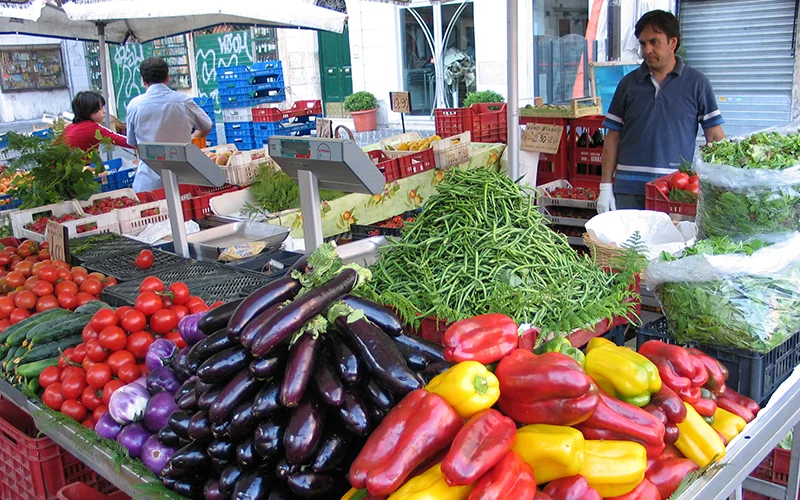 Peppers, eggplants and tomatoes on a market stall in Rome