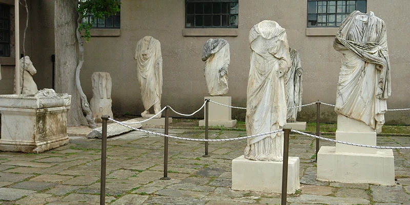 Draped marble statues in the museum gallery