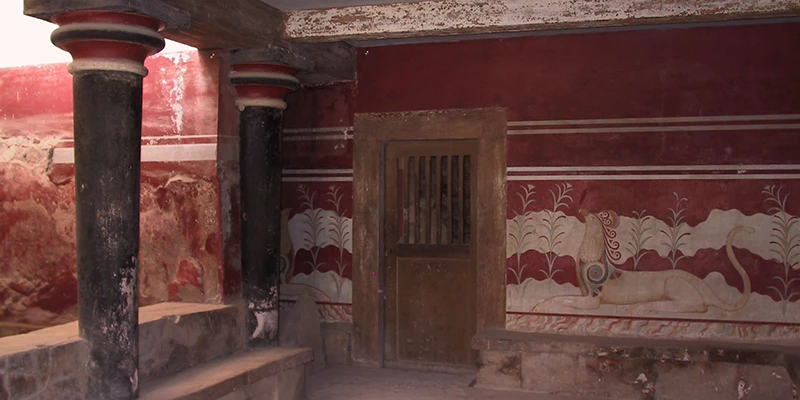 Frescoed hall with red columns inside the Palace of Knossos