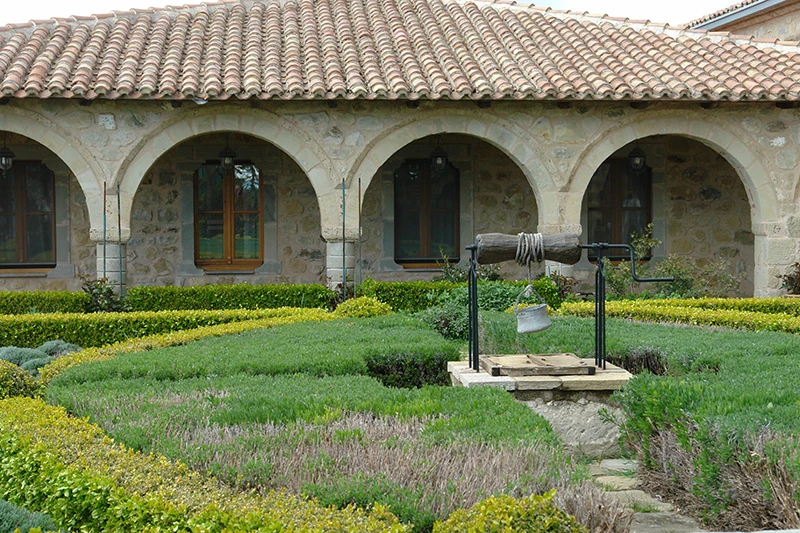 Arcaded courtyard and garden inside a Meteora monastery