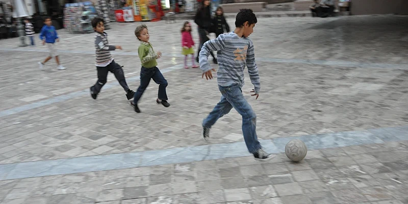 Children playing in a square in the Nafplion old town