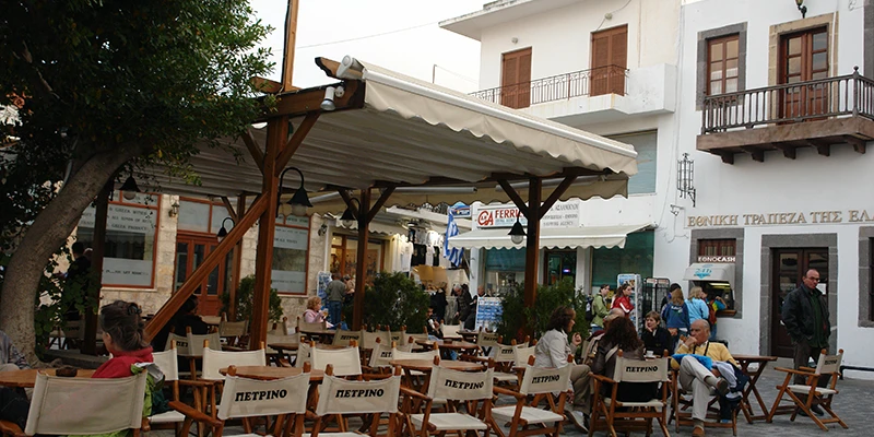 Waterfront taverna tables in Skala