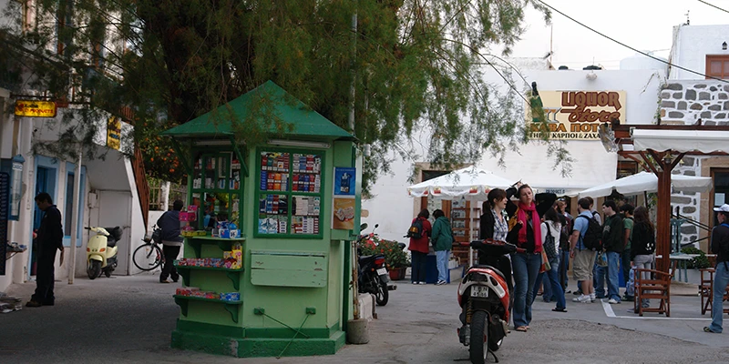 Souvenir stalls and shoppers in Skala