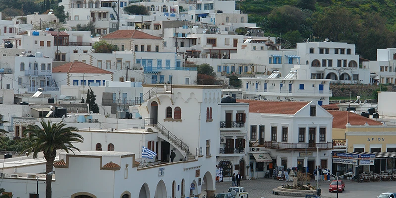 Whitewashed houses climbing the hillside of Patmos
