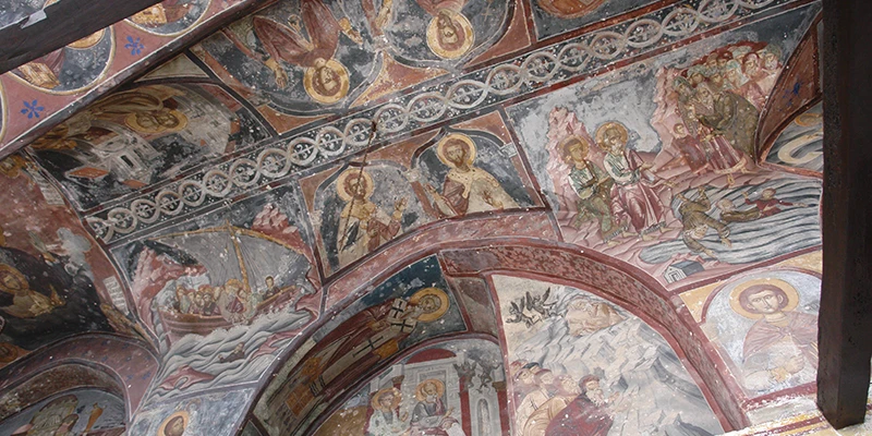 Detailed frescoes covering the church ceiling