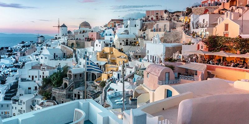 Pastel-colored houses of Ia at dusk