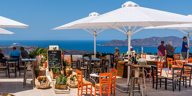Colorful outdoor dining tables in Santorini