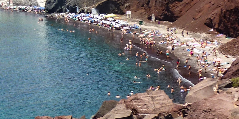 The Red Beach cove below the cliffs of Santorini