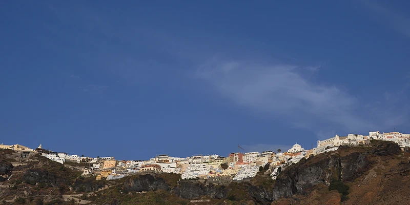 Cliff-top houses of Santorini against the sky