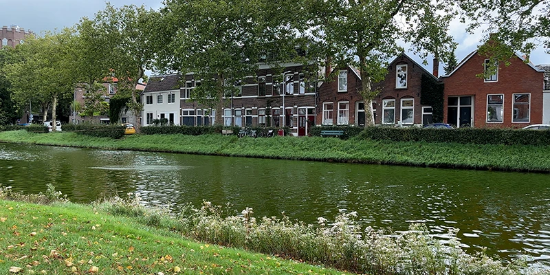 A Middelburg canal lined with gabled brick houses and moored boats
